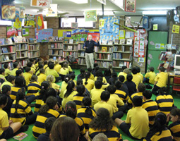 Duncan Ball talking to a group of children